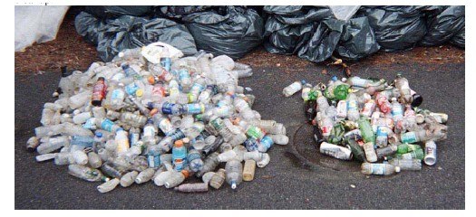 One large pile of non-deposit containers and one smaller pile of deposit containers
